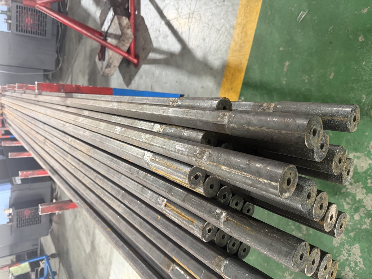 Drill rods staged on floor